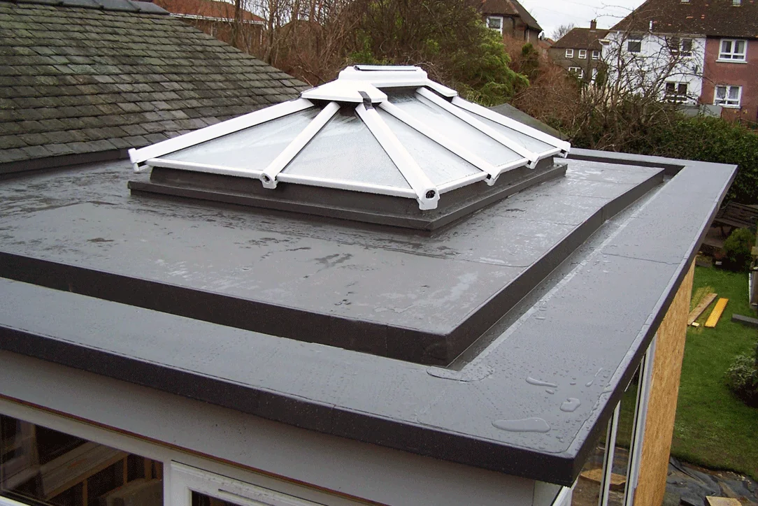 Single-ply flat roof to a house extension with a new glazed roof lantern, Ayr