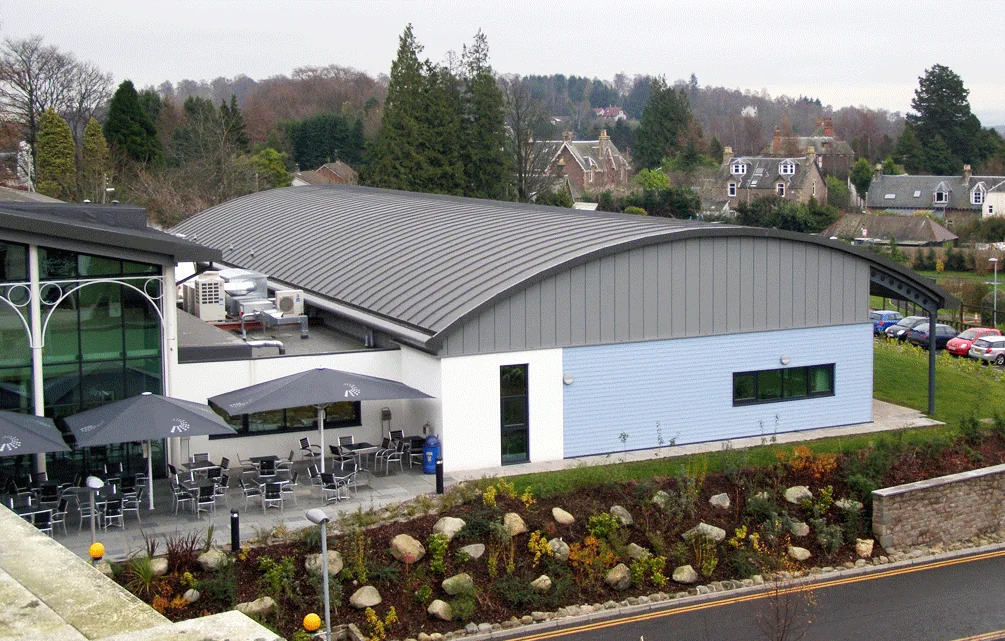 Barrel curved standing seam roof over a hotel play area and cafe bar, Crieff Hydro