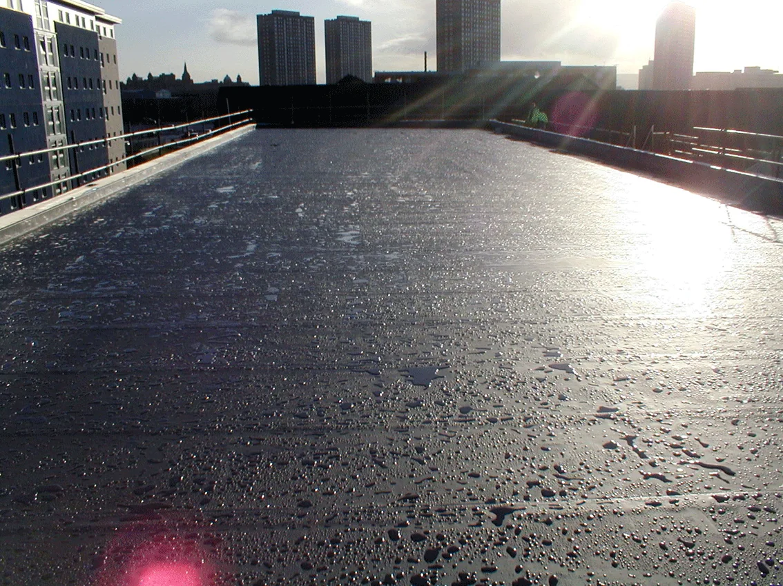 Insulated single-ply roof on a Glasgow call centre with the city skyline behind