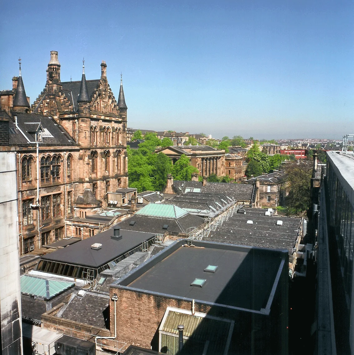 Adhered single-ply roof set between lead roofs on a listed building at Glasgow University
