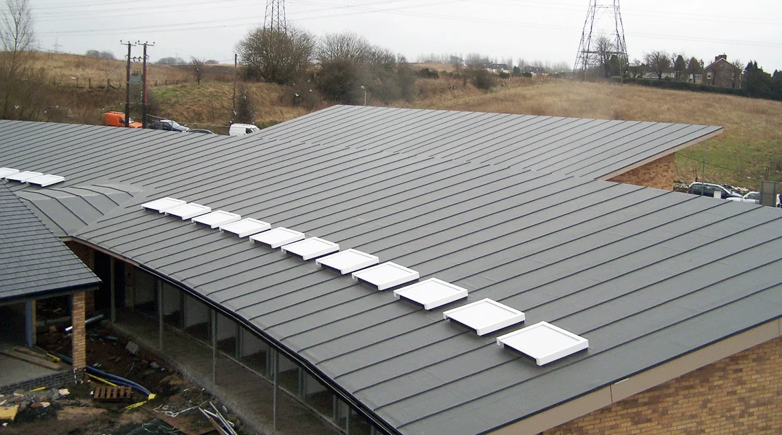 Large single-ply membrane roof with a run of white rooflights, Dogs Trust, Uddingston